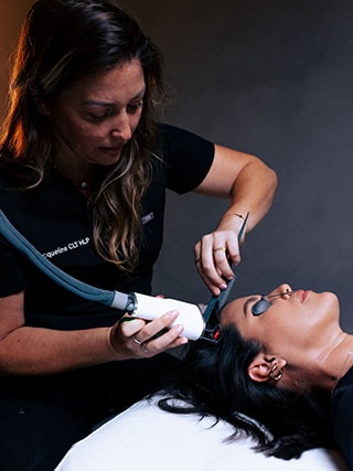 Woman Receiving Hair Restoration Treatment